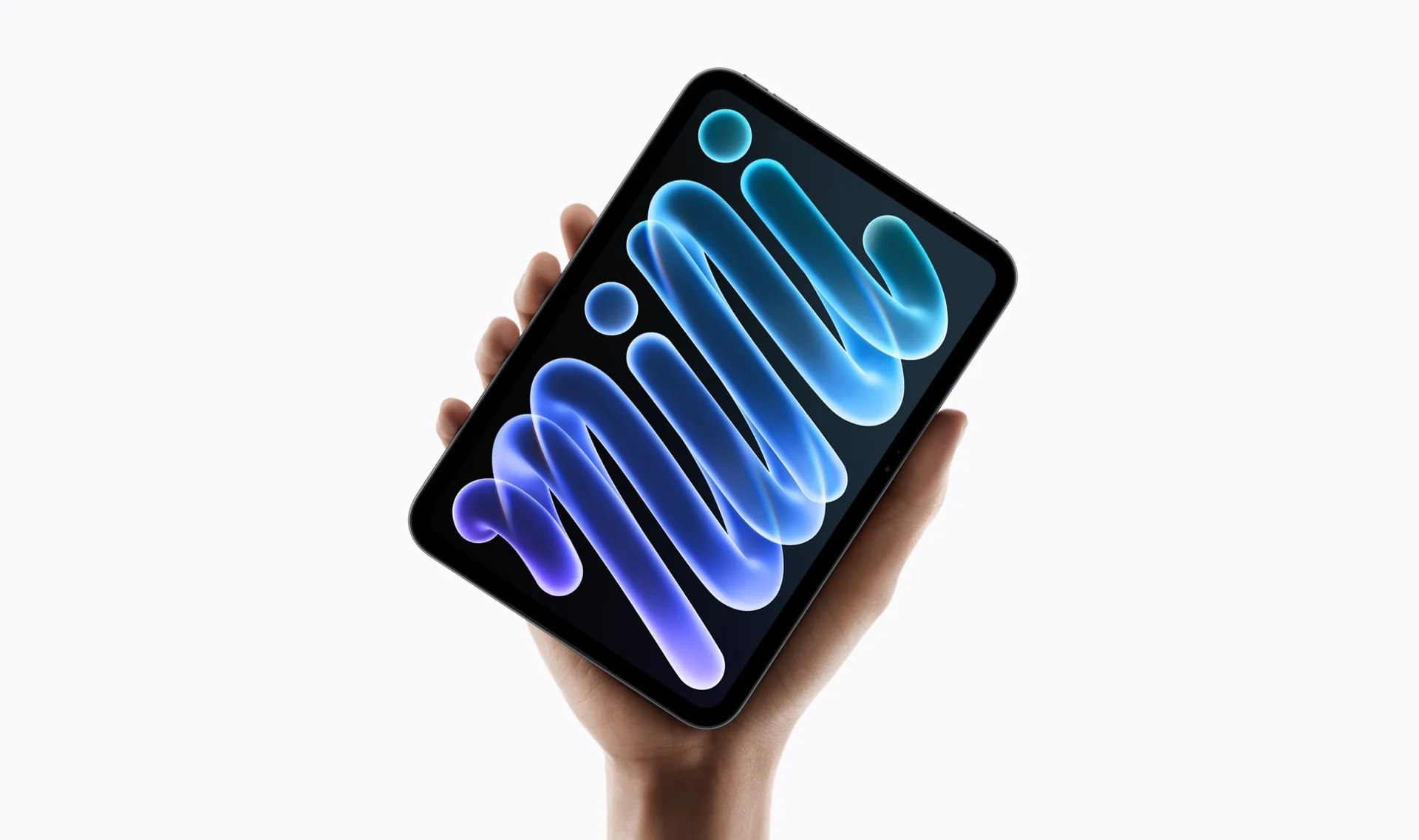 A hand holds the new iPad mini vertically with its blue and purple wallpaper