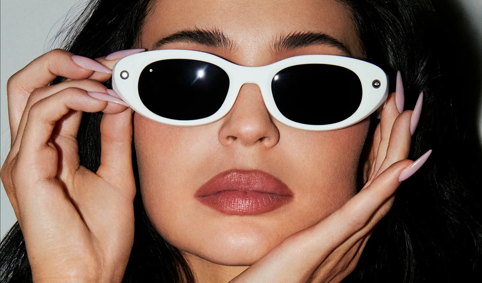 Kylie Jenner wearing Meta Starfire Kylie Edition with an Ivory frame and Black lenses