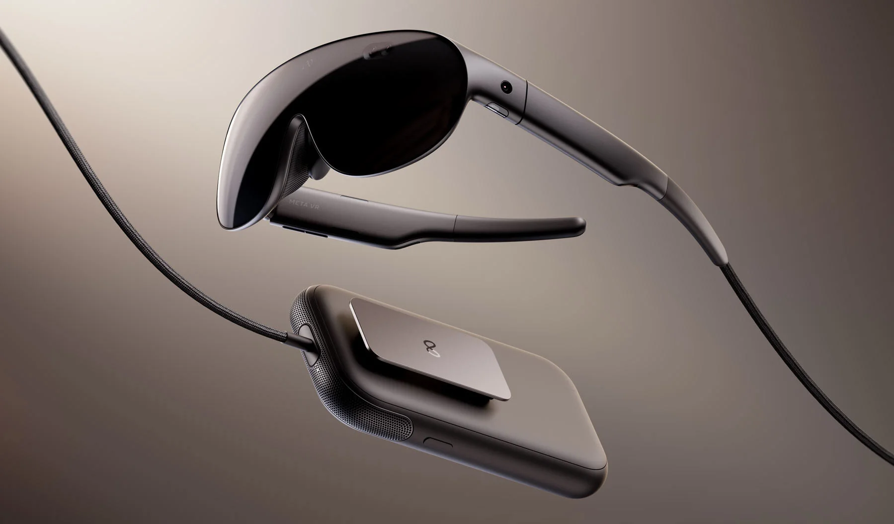 Meta VR Glasses connected by optical cable to their compute puck