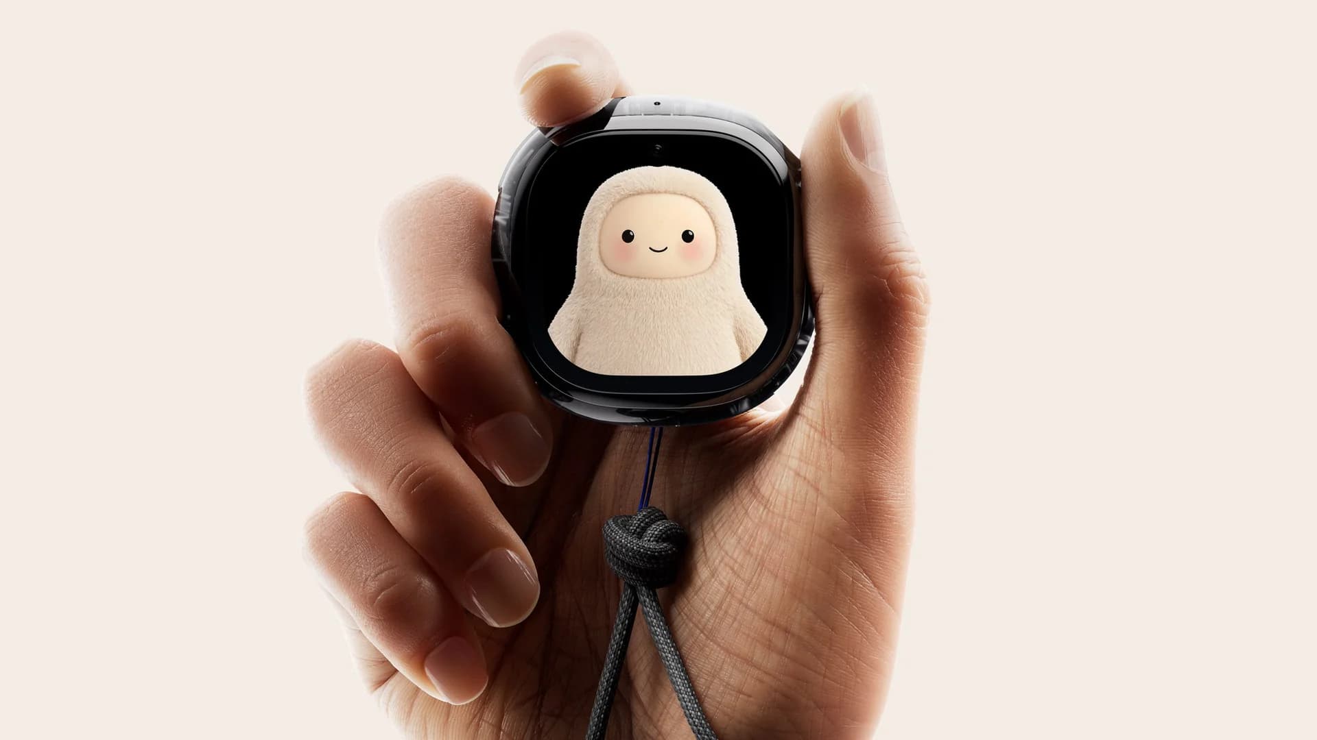 Hand holding Muse Charm with the Muse agent visible on the screen